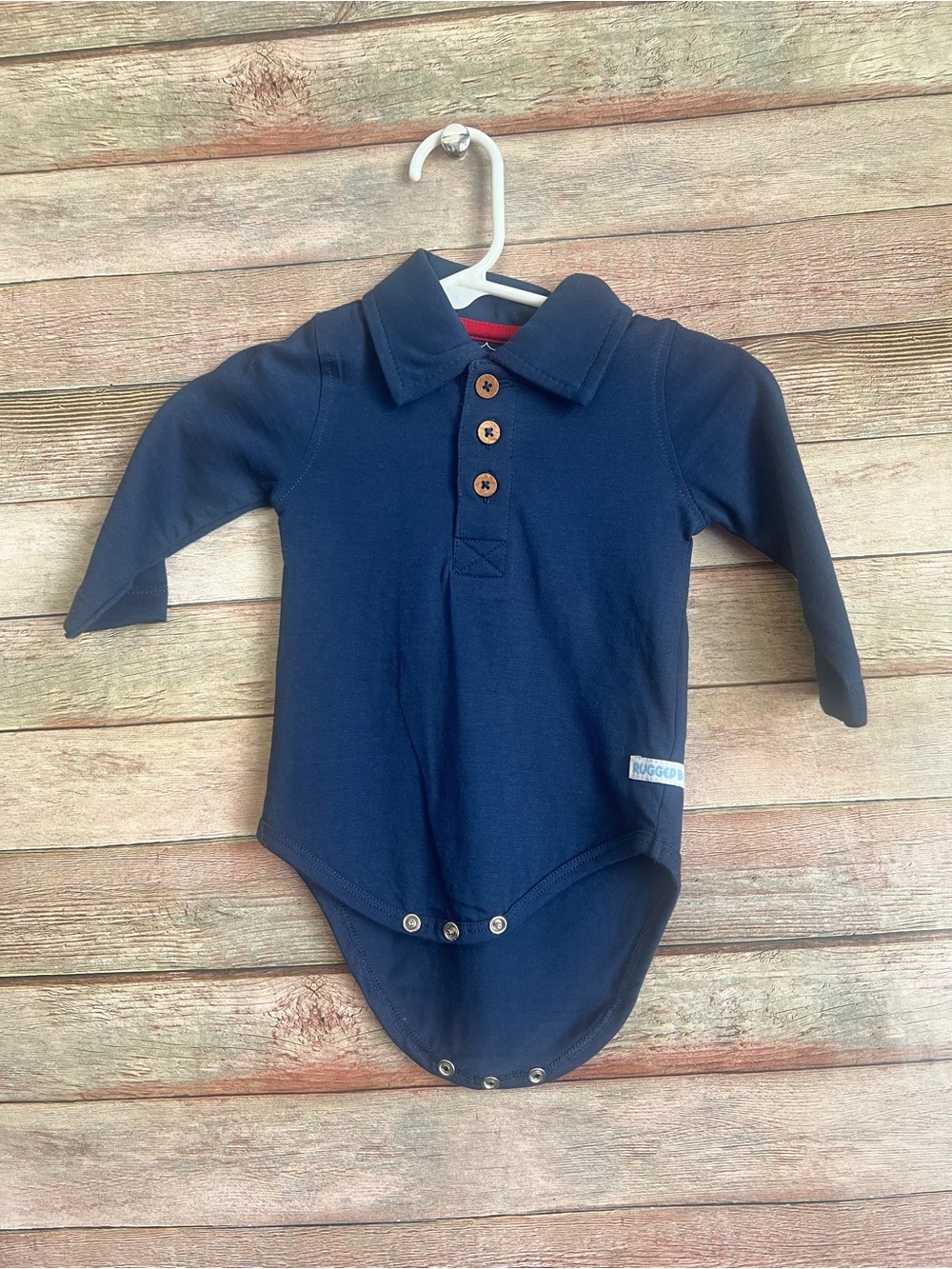 Ruffle Butts Navy Long Sleeve Polo Bodysuit
